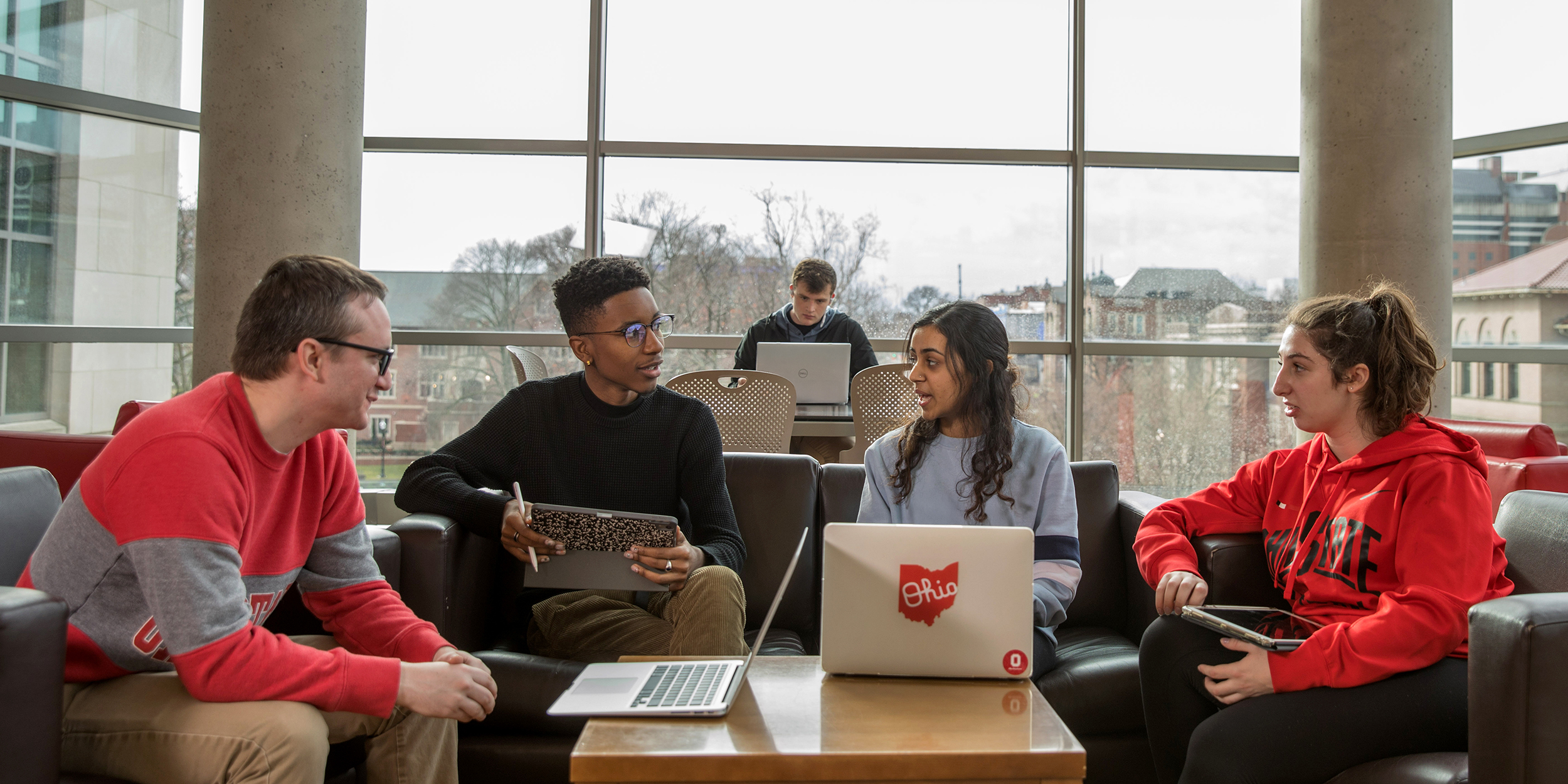 group of students sitting and having a conversation