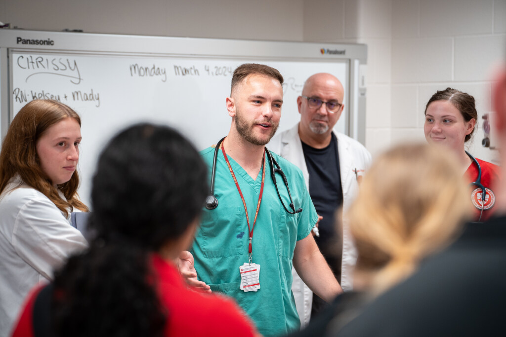 Picture of nursing faculty lecturing students in a classroom.