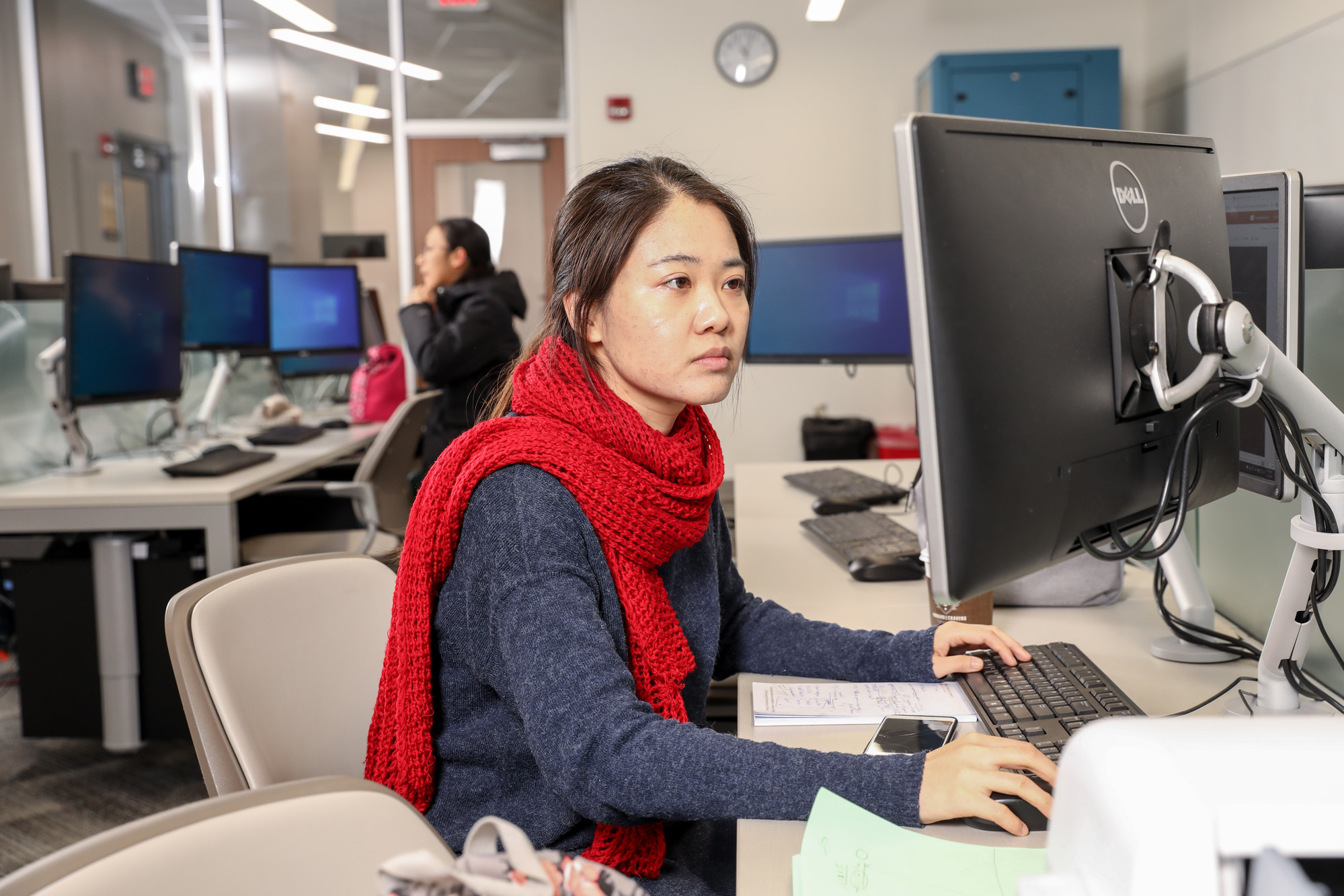 Young student sitting at computer