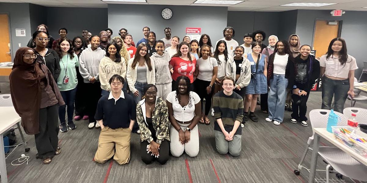 Large group of students pose for a photo