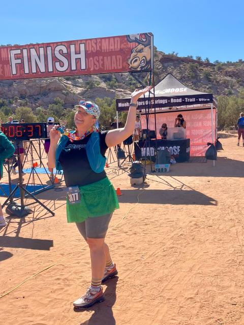 Kacy King at the finish line of a desert race.