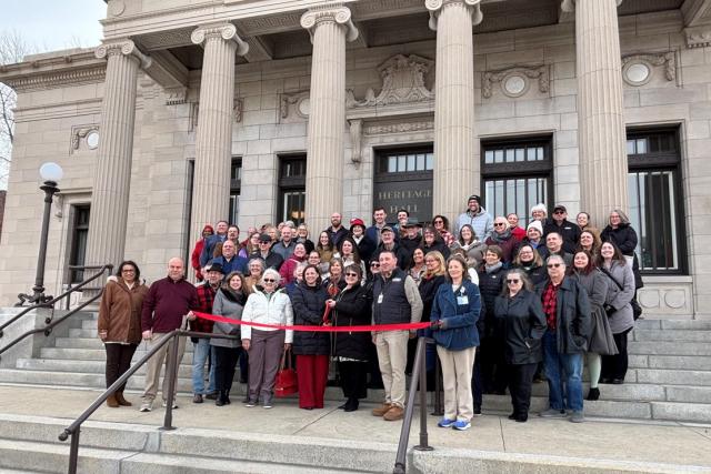 A group of people at a ribbon cutting in Marion. 